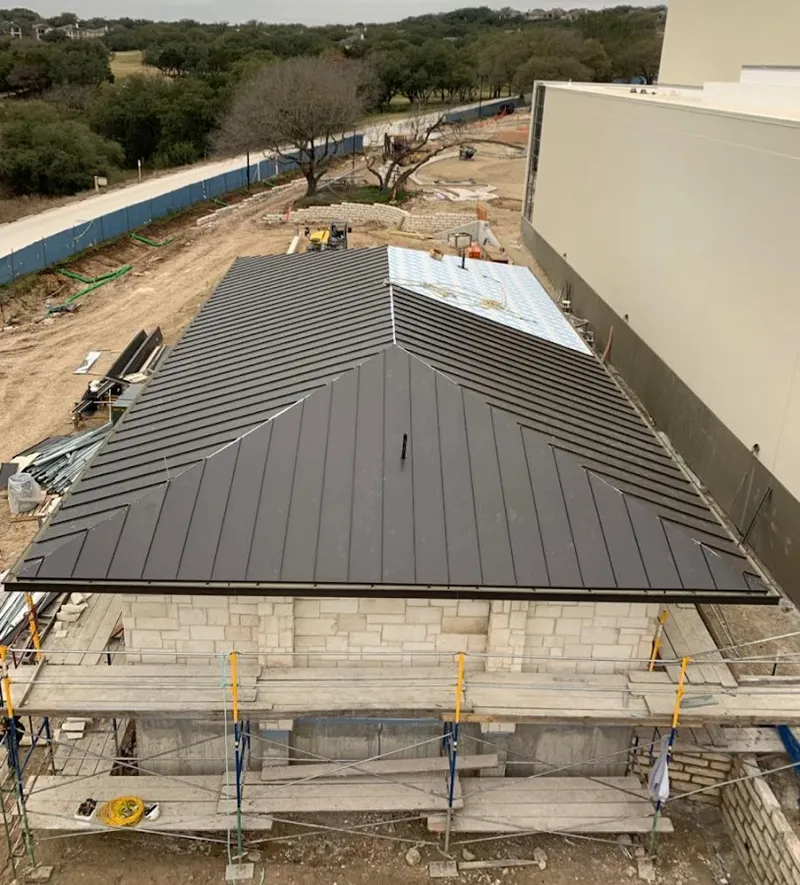 Metal roof new construction with scaffolding in Central